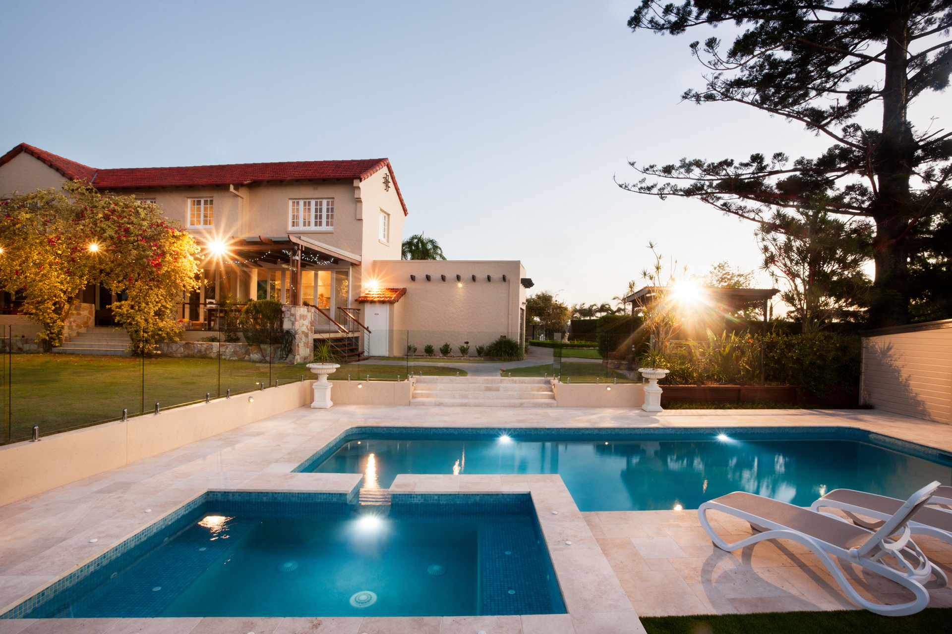 Backyard pool and spa at twilight